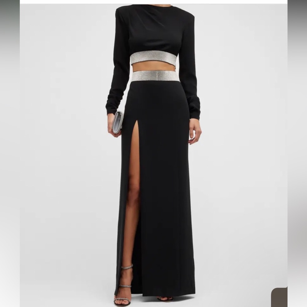 Worn once to an event for a couple hours. Dry cleaned after, like new.